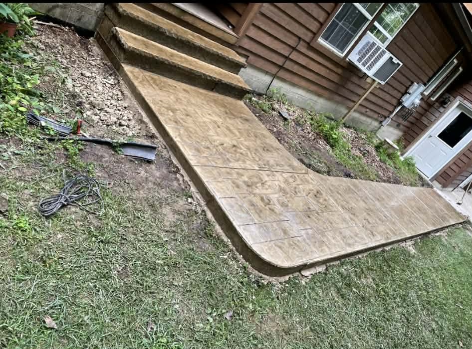Stamped concrete steps and walkway in a warm slate pattern
